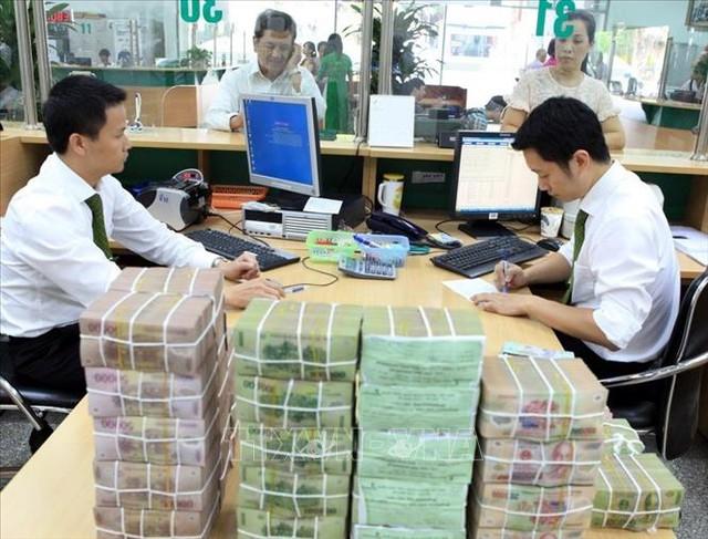 Hoạt động tại Vietcombank chi nhánh Hà Nội. Ảnh (tư liệu) minh họa: Trần Việt/TTXVN